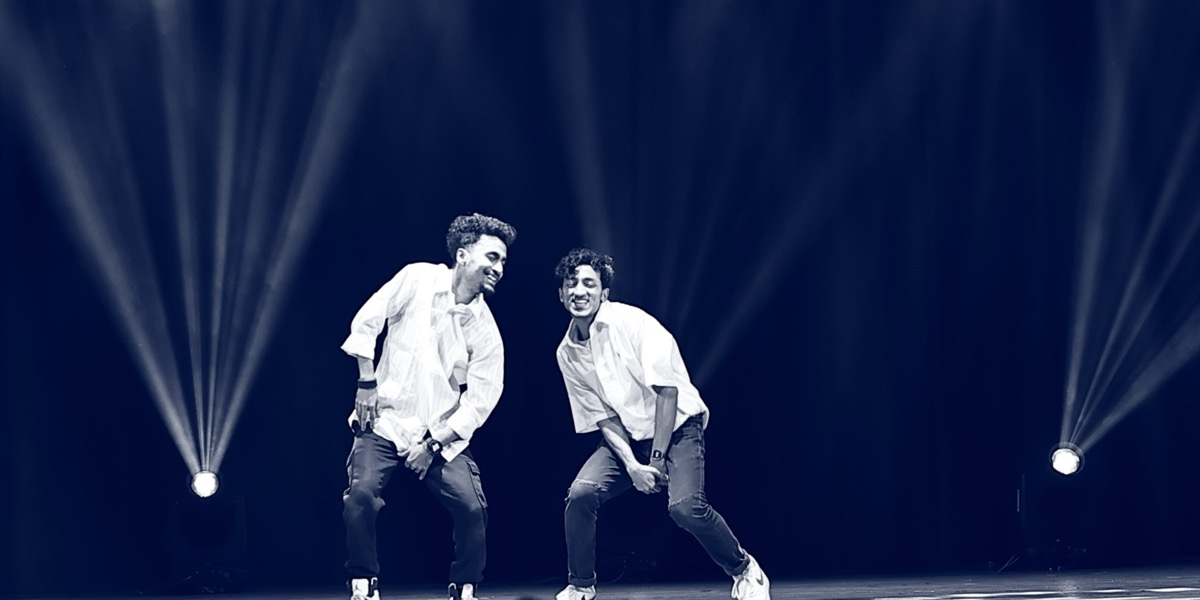 Hip hop duo performing under stage lights at Twist N Turns Dancing Wonder