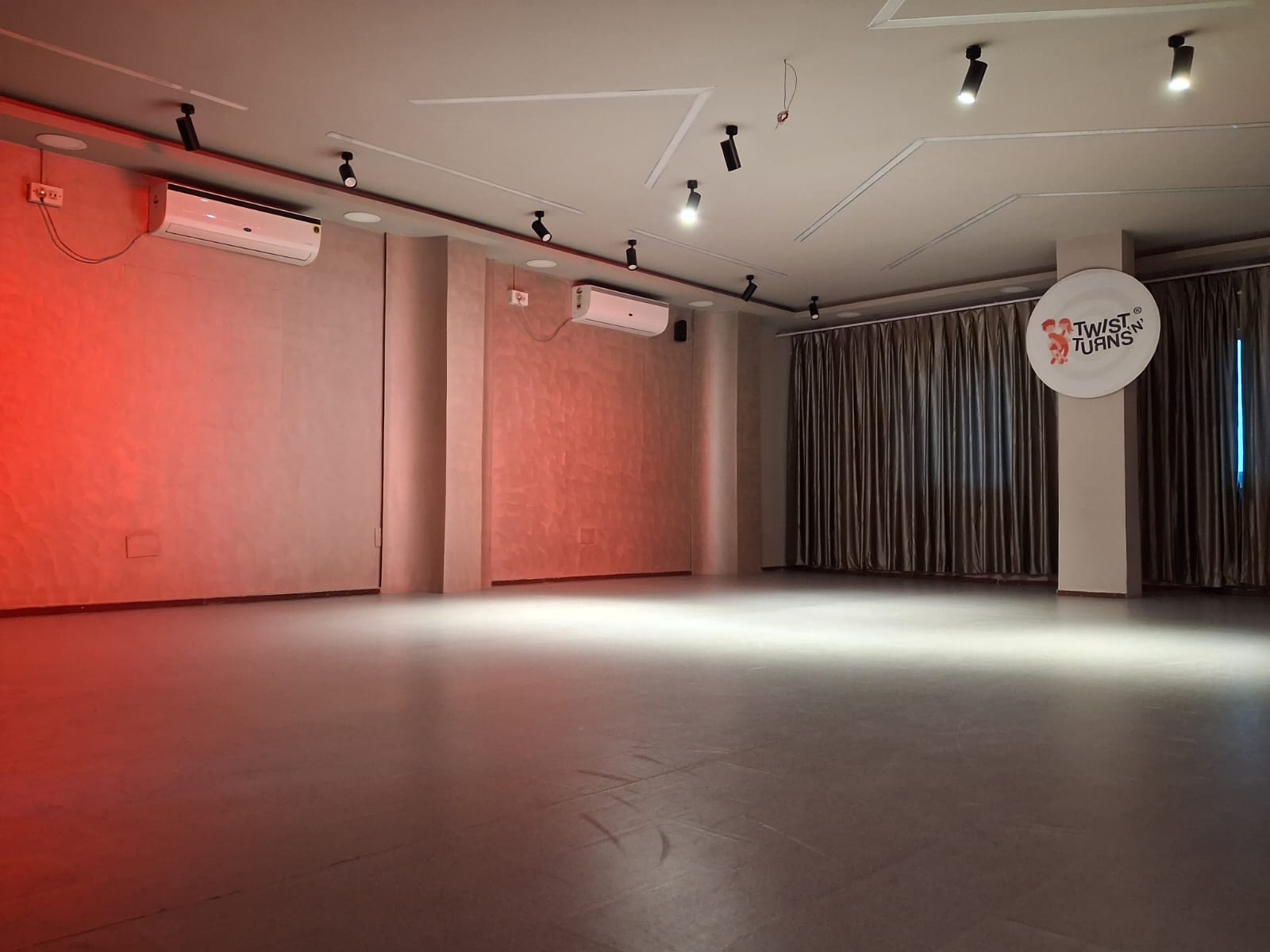 Ruby studio upgrade 2026 — textured walls, track lighting & TNT logo